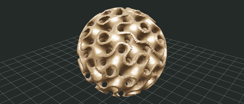 A bronze sphere carved from a gyroid lattice, full of curving tunnels